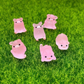 Kit 6 Mini Porquinhos Luminosos – Brilham no Escuro em Poses Diferentes