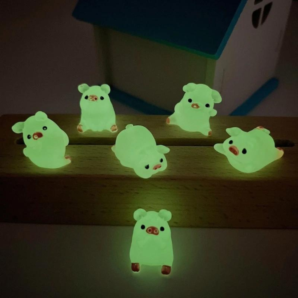Kit 6 Mini Porquinhos Luminosos – Brilham no Escuro em Poses Diferentes